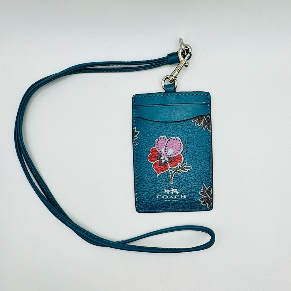 Teal Leather with pink flowers.  Coach ID Lanyard Wildflower pink bouquet card